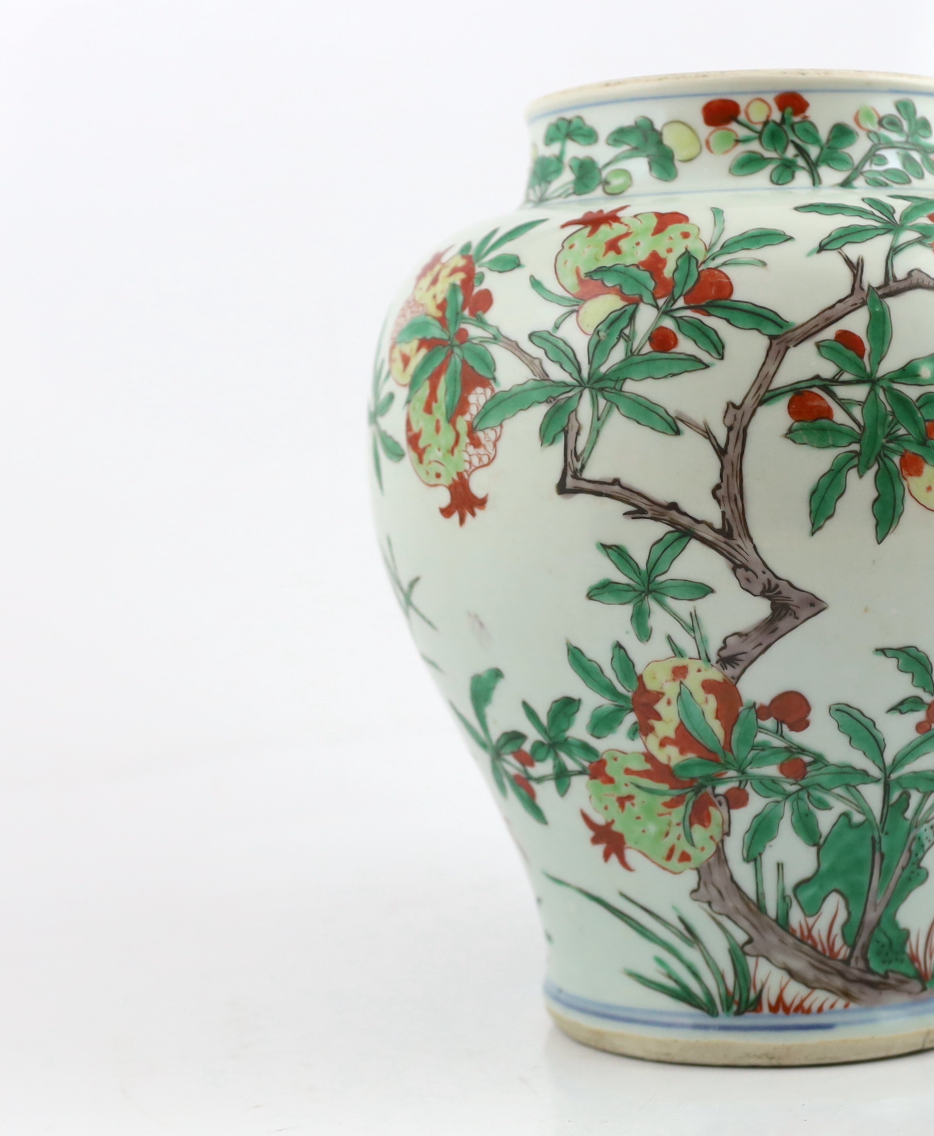 A Chinese wucai ‘pomegranate’ baluster vase, Transitional, Shunzhi period, c.1650